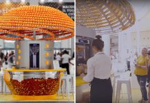 Машина, отжимая сок, перерабатывает апельсиновые корки в стаканчики